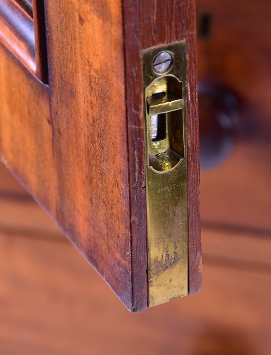 A 19th century mahogany linen press with two cupboard doors over two short and three graduated - Image 4 of 7