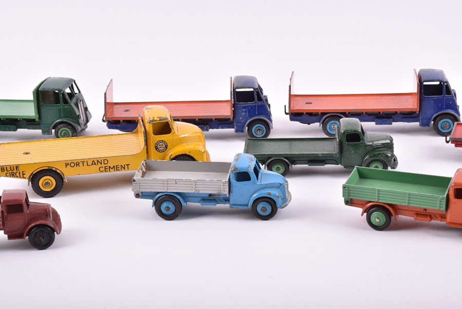 A collection of loose and playworn Dinky Toys vehicles to include three 422 Fordson Trucks, a 533 - Image 4 of 4