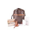 A Louis Vuitton shoulder bag along with a Dunhill loose powder box and a boxed Concorde hip