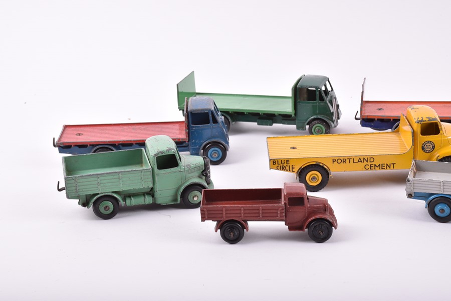 A collection of loose and playworn Dinky Toys vehicles to include three 422 Fordson Trucks, a 533 - Image 3 of 4