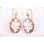 A pair of 9ct yellow gold, diamond, and cameo drop earrings each with an oval cameo depicting a