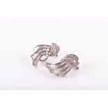 A pair of 18ct white gold and diamond earrings set with brilliant-cut and baguette-cut diamonds,