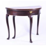 A George II mahogany demi-lune tea table on four hoof feet, 71 cm high x 83 cm wide.