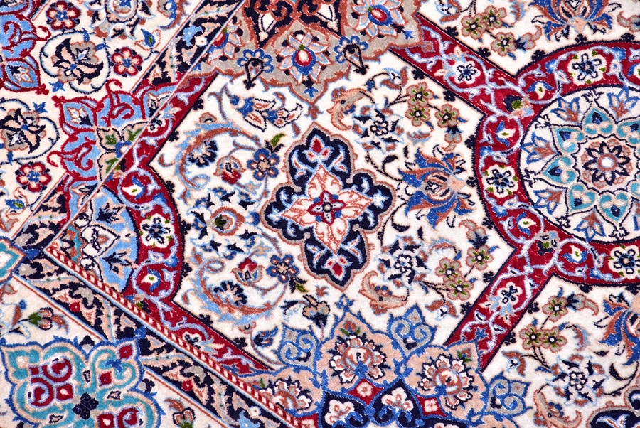 A contemporary Iranian part silk carpet with fringed ends, the ivory field decorated with a stylised - Image 5 of 5