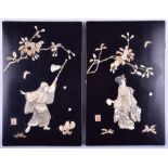 A pair of early 20th century Japanese lacquered inlaid cut bone panels with figures below blossoming