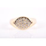 Tiffany & Co. An 18ct yellow gold and diamond ring the oval-shaped mount pave set with round-cut