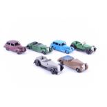 A collection of eleven early Dinky Meccano vehicles to include a Lagonda, Triumph, Austin Devon