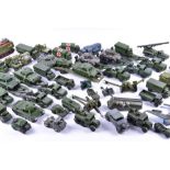A large quantity of loose and playworn diecast Dinky and Corgi military vehicles to include tanks,