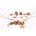 A group of gold jewellery items to include a 9ct yellow gold charm bracelet suspended with various