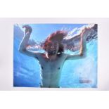 Nirvana: a colour photographic print of Kurt Cobain replicating the underwater cover shot of