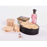 A collection of curios  to include a Victorian flashed cranberry glass snuff bottle, an enameled
