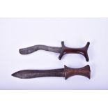 Two old wooden handled Eastern daggers one with a curved blade and Y shaped symmetrical handle, 26