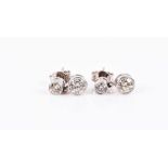 A pair of 18ct white gold and diamond drop earrings each with a round-brilliant cut diamond