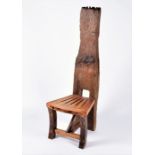 A tall back rustic wooden chair with pierced seat and bark back, 149 cm high