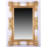 A Continental gilt framed mirror possibly Florentine, the gilt gesso frame modelled as stylised