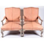 A pair of large reproduction armchairs  in the Regency style, with studded leatherette upholstery on