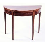 An Edwardian flame mahogany demi-lune card table with satinwood cross banding and baize lined