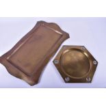 Two Arts and Crafts trays and a copper arts and crafts trivet the copper tray with beaten decoration