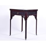 A 19th century rosewood envelope card table with pierces and carved frieze, opening to reveal a
