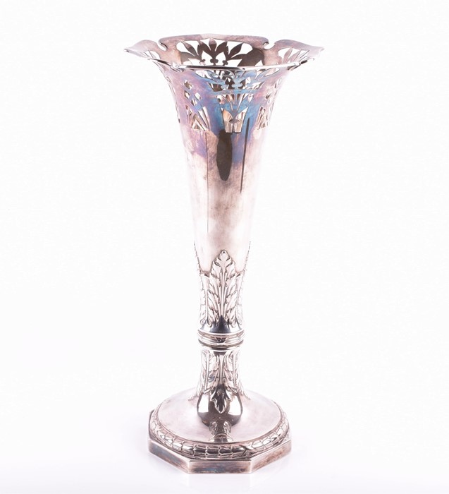 A German Art Nouveau silver vase stamped 800, the fluted neck pierced with floral patterns in the