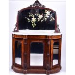A Victorian figured walnut credenza the mirrored back painted with flowers, with a white marble top,