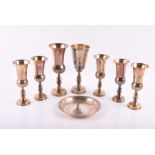 Seven silver Kiddish cups and a tray for Passover All London, varying makers and dates, the bodies