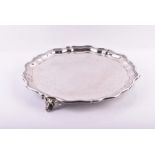 A Victorian silver salver Sheffield 1856, James Dixon and Sons, with scalloped borders, raised on