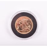 A full sovereign dated 2001, in plastic presentation case.