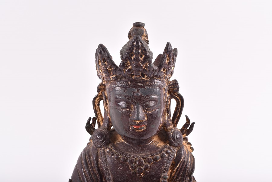 A 19th century or earlier Tibetan gilt bronze sculpture of Padmasambhava modelled seated in - Image 3 of 10