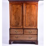 A 19th century Georgian style mahogany linen press with dentil frieze cornice above two central