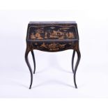 An early 20th century small Chinoiserie ladies bureau with applied and gilt decoration on a black