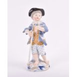 A Meissen porcelain figure of a boy decorated in poychrome enamels on a rococo style base, blue