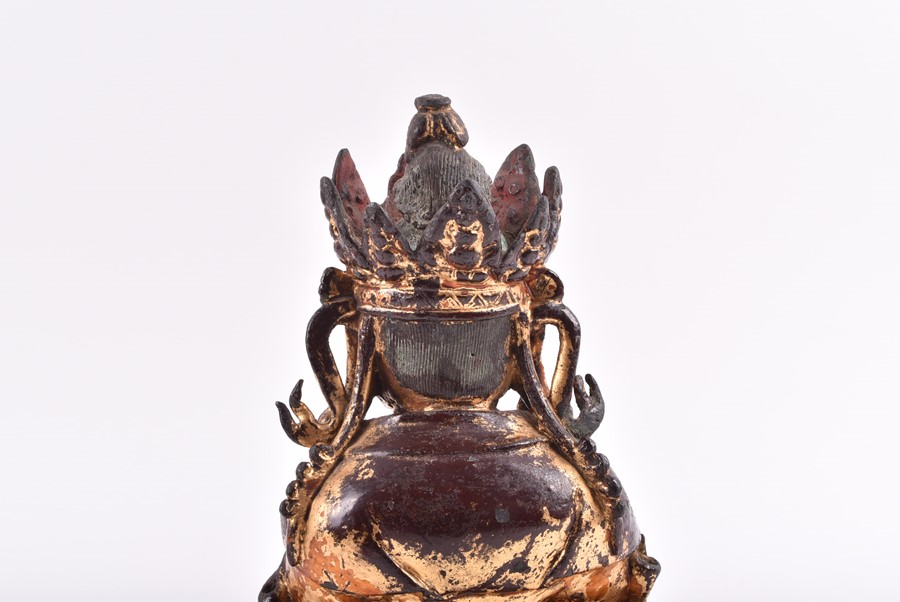 A 19th century or earlier Tibetan gilt bronze sculpture of Padmasambhava modelled seated in - Image 7 of 10