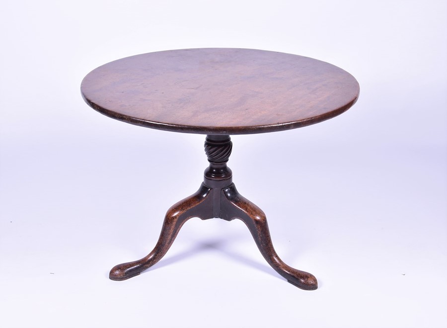 A George III mahogany breakfast table on a twisted column and tripod base, presumably cut down at