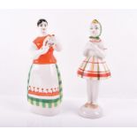 Two ZHK Polonne figures circa 1950 to 1970, both figures modelled as standing females in folk dress,