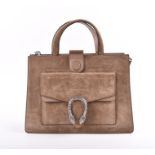 Gucci. A green suede satchel style handbag of rectangular form, the front pocket with metal clasp,