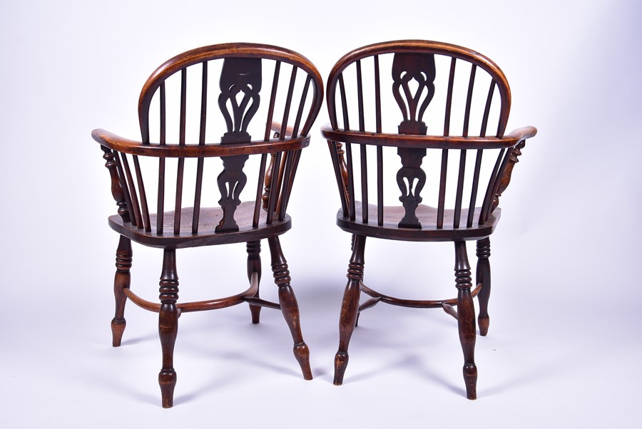 A near pair of 19th century elm and ash Windsor armchairs each with pierced vase splatbacks and - Image 4 of 7