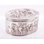 An early 20th century Dutch silver box and cover the body of oval form, scenes of taverns and