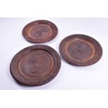 Two turn of the century Russian carved wood 'bread and salt' plates the carved borders with Cyrillic