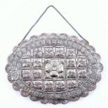 An Ottoman silver wedding mirror the polylobed oval silver frame with lattice pattern and floral