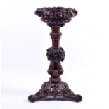 A fine quality 19th century carved jardiniere  the top deeply carved with flowers, corn, wheat-