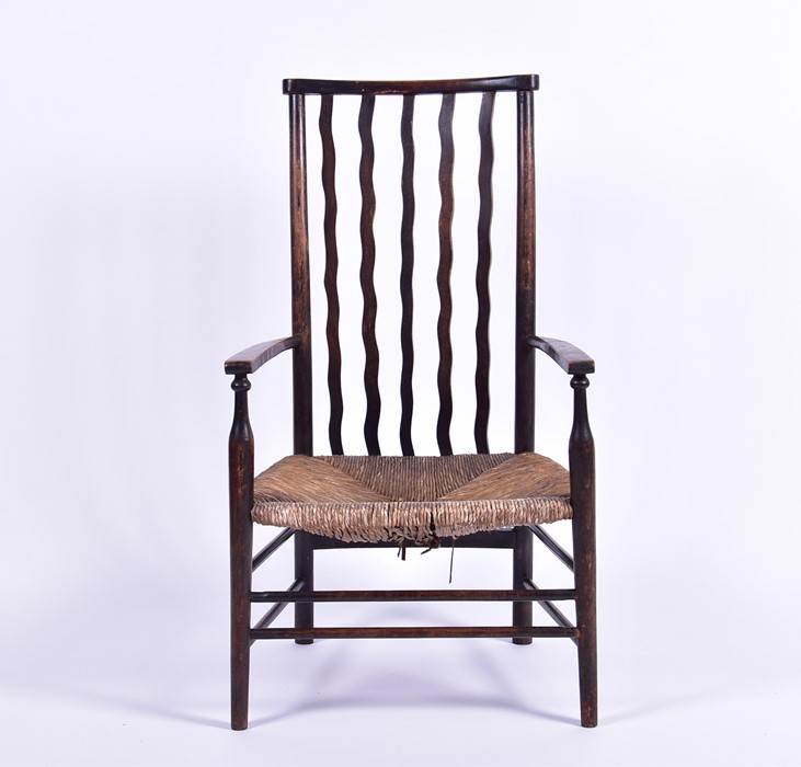 A 19th century rush seated low carver chair in the Arts and Crafts style, the seat 30 cm high. - Image 3 of 4