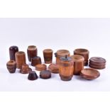 A collection of treen containers to include two 19th century pieces of Mauchline ware and a turned