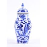 A small blue and white Chinese porcelain vase with Kangxi Nianzhi character mark to underside,