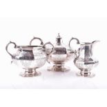 An early 19th century three piece silver tea set 1845 London, Charles Lias, the faceted bodies