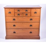 An Edwardian satinwood chest of drawers with inlaid cross banding, two side drawers and two