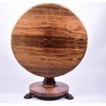 A William IV circular rosewood breakfast table, the circular tilt top with sloped border, set