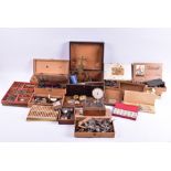 A large collection of watchmakers tools and accoutrements to include skeleton clock parts, hands,