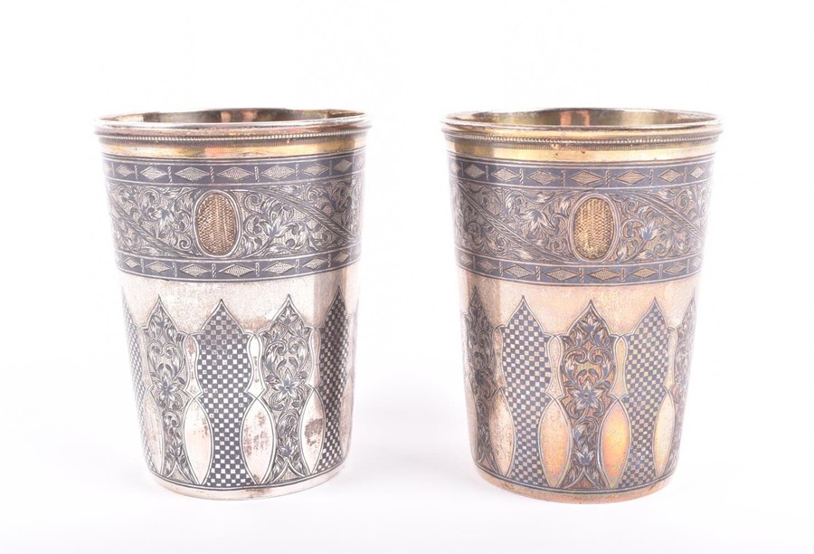 A pair of parcel gilt and niello Greek silver beakers designed with flat chasing foliage frieze - Image 4 of 5
