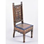 A Haida tribal carved and wash painted chair the splat designed with carved and pierced